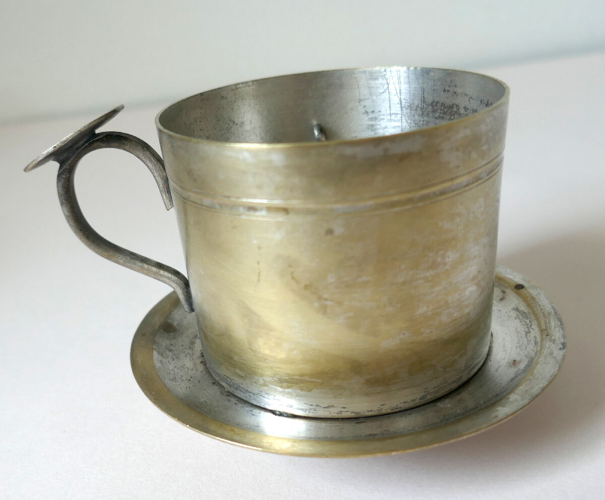 Individual silver metal coffee maker