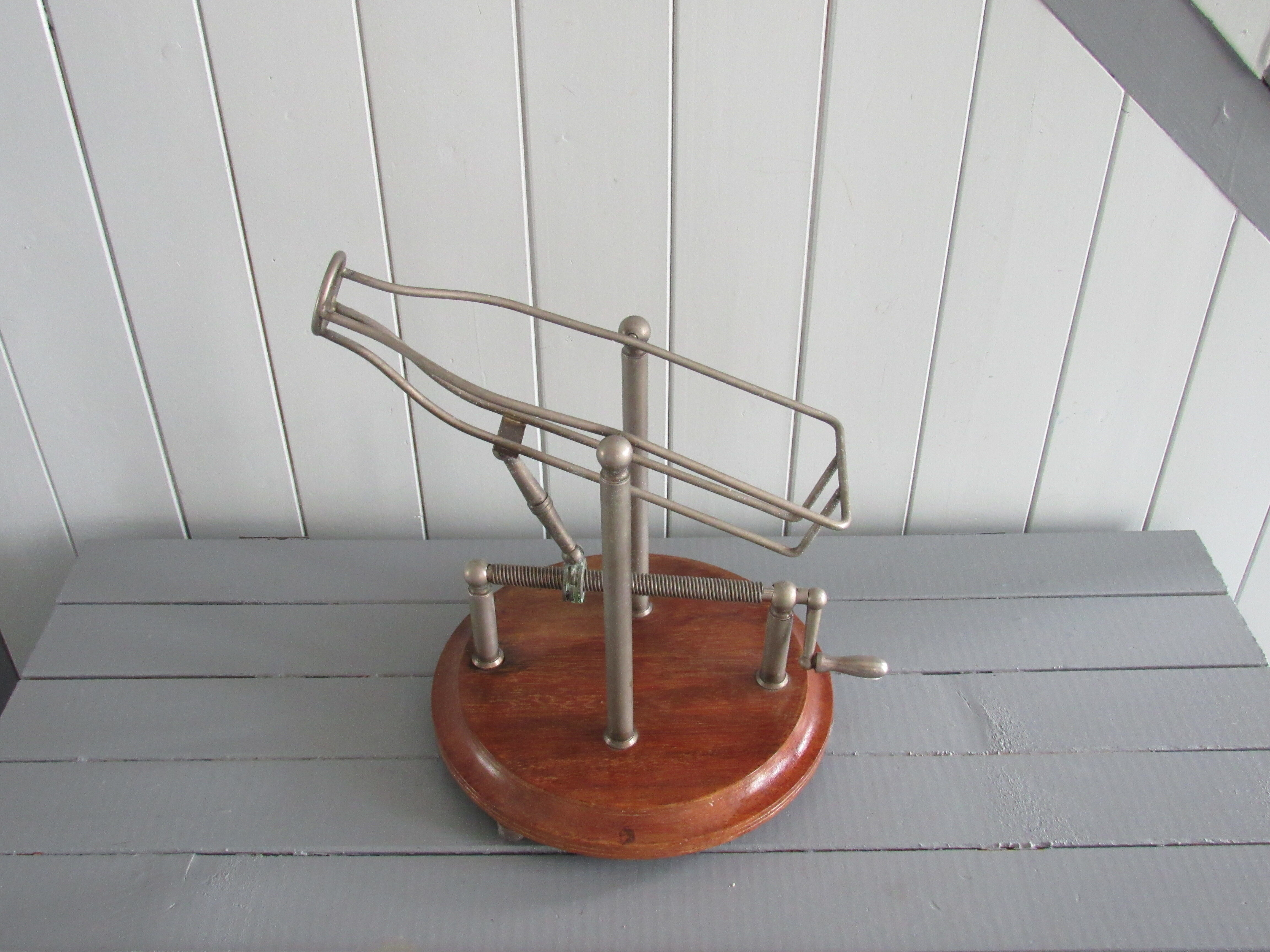 Old mechanical wine decanter on wooden base