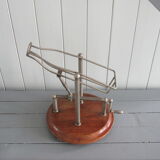 Old mechanical wine decanter on wooden base