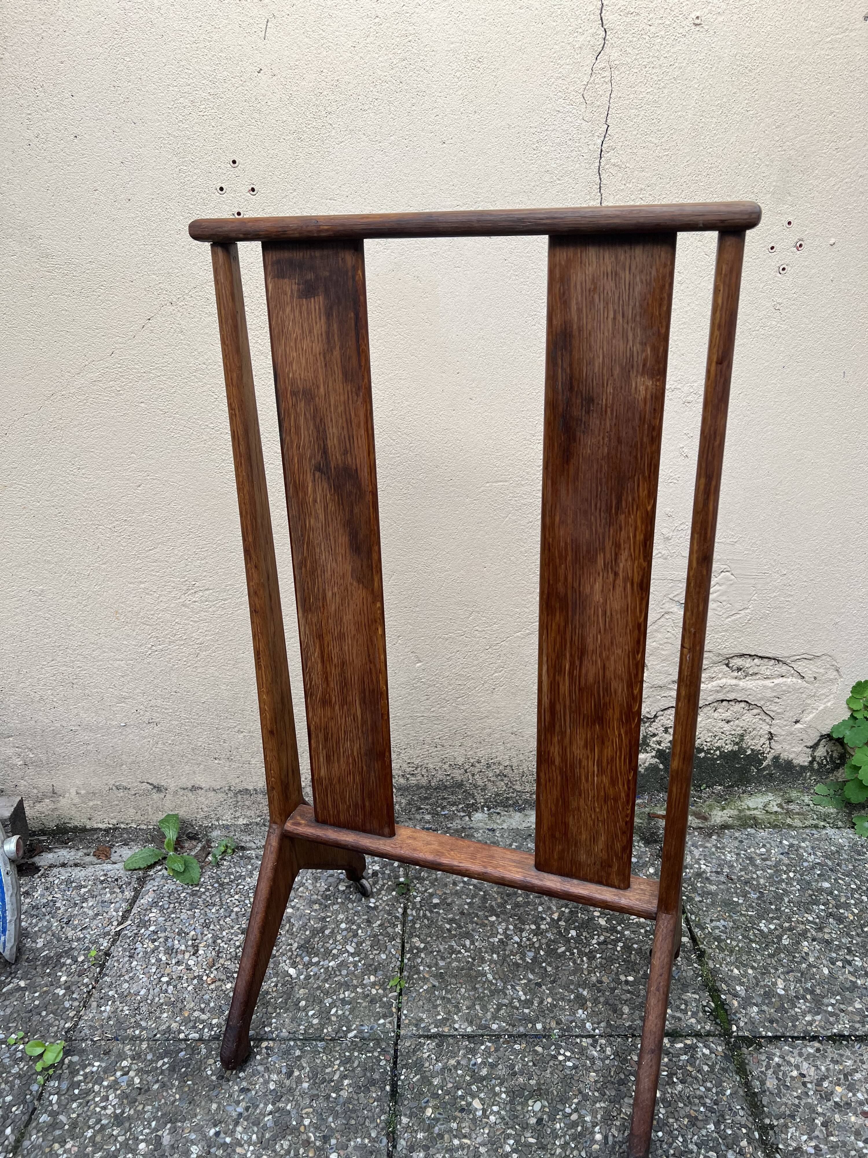Old wooden shop rack valet casters