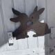 Cast iron plate in the shape of rabbits