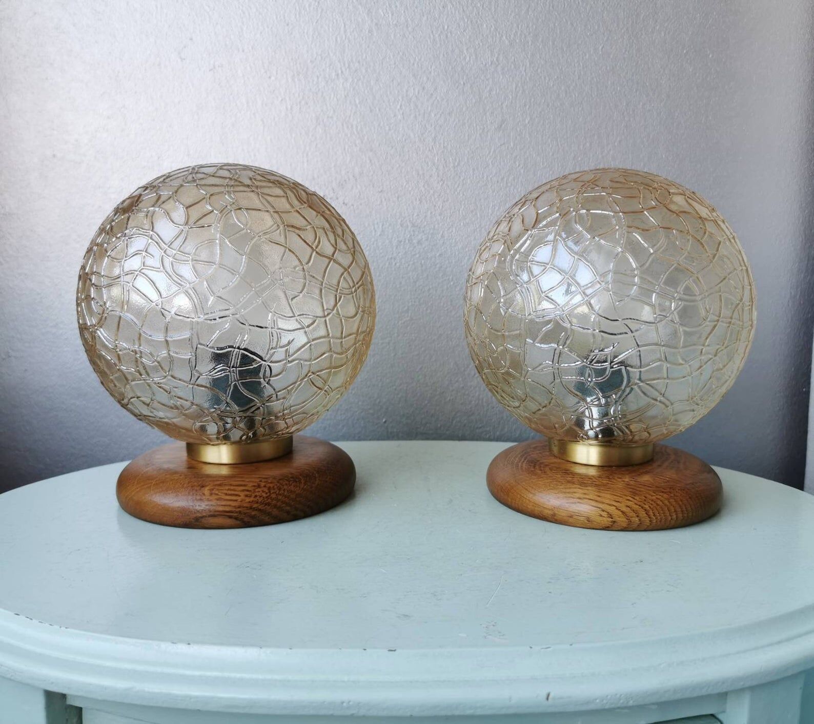 Wooden table lights with 70s gold glass hood