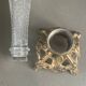 Pair of candlesticks in spelter and moulded glass