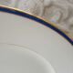 2 round dishes Limoges porcelain blue and gold border