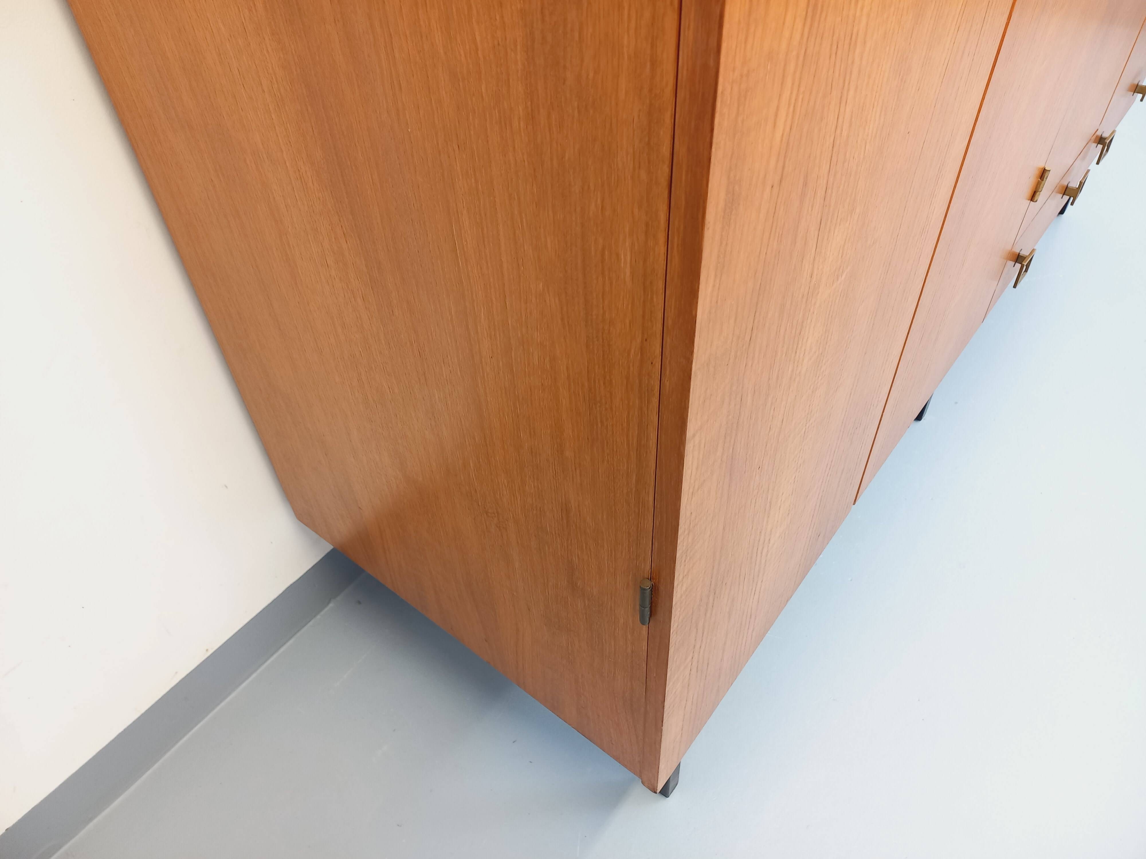 Vintage modernist wardrobe in teak and metal from the 1960s.
