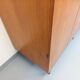 Vintage modernist wardrobe in teak and metal from the 1960s.
