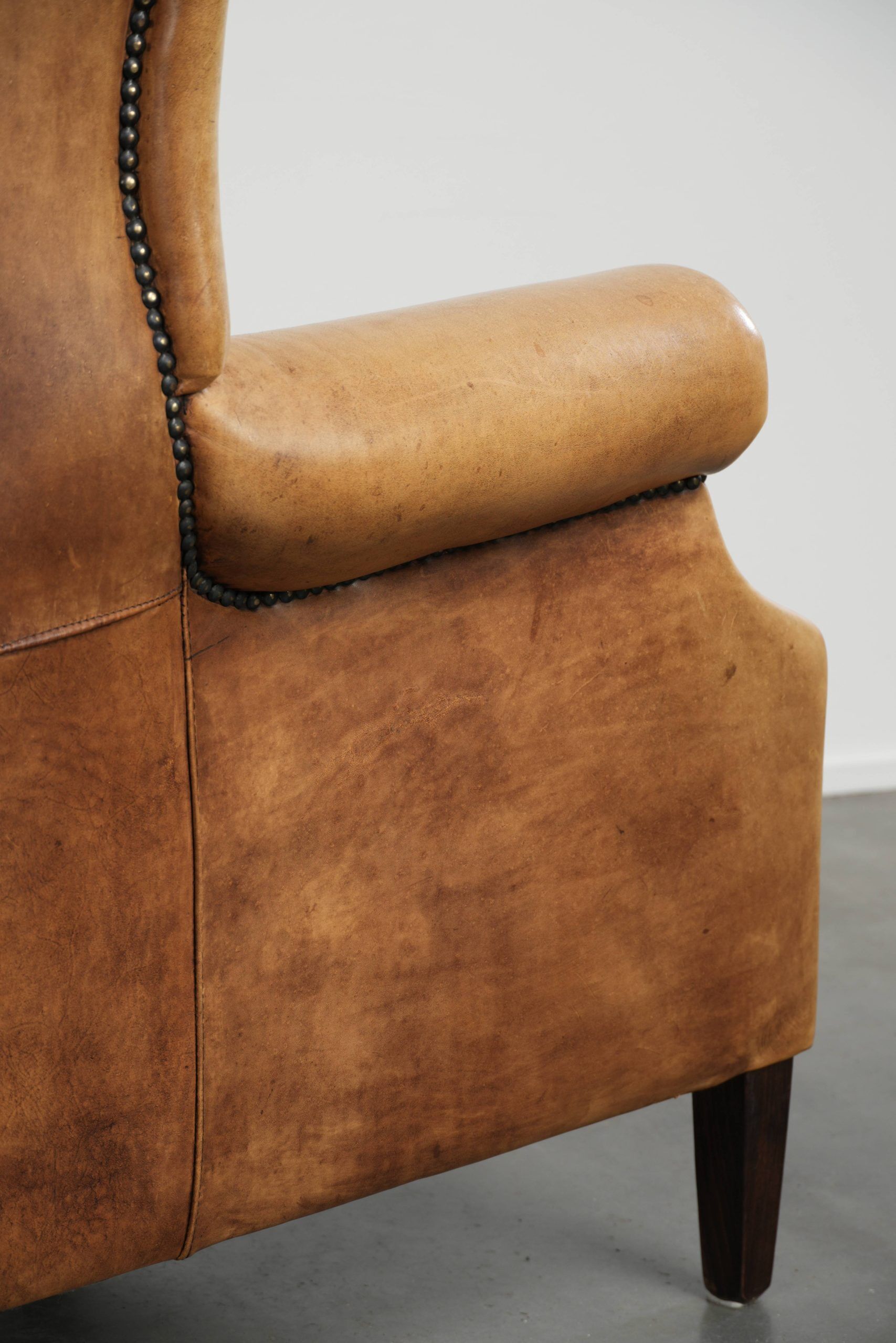 Cow leather wingback armchair with a beautiful timeless English look