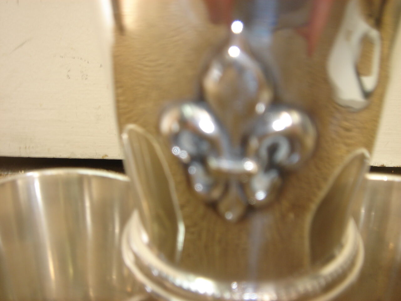 3 silver cups, lily flower