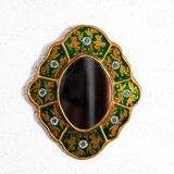 Golden mirror with decor