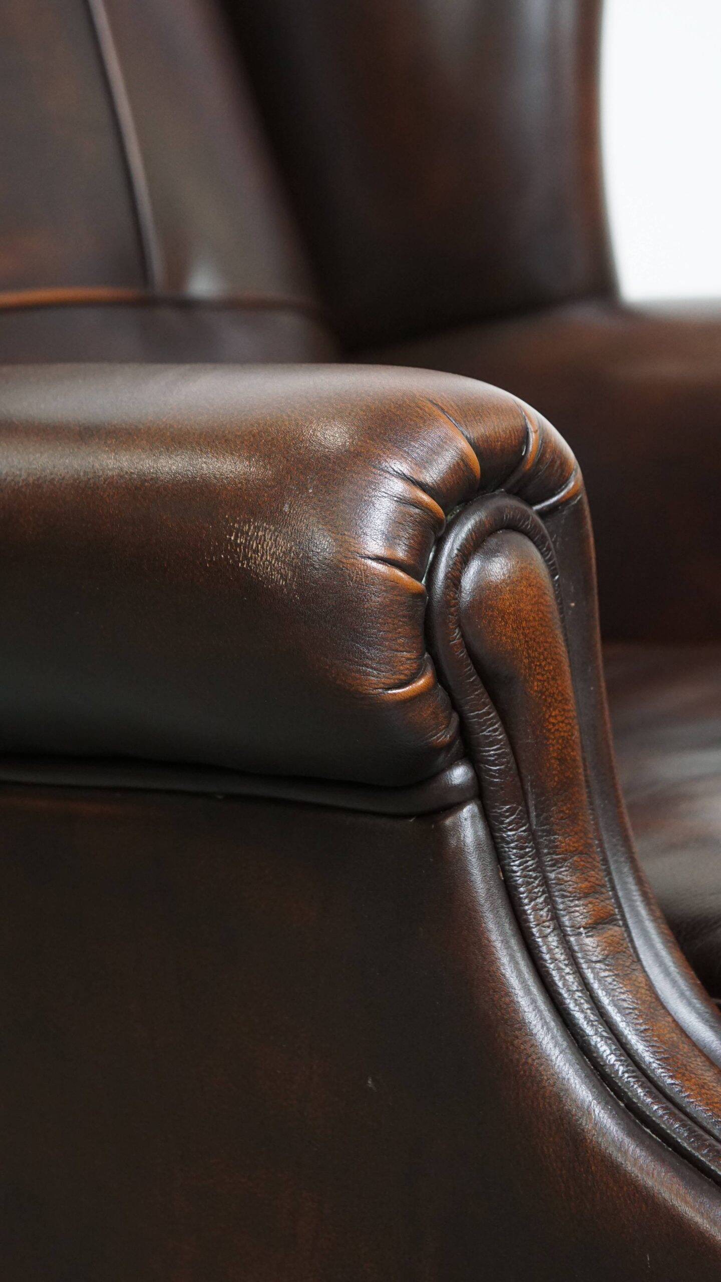 Very beautiful wing chair made of cowhide leather in English style