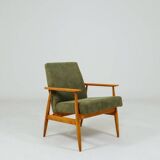 Mid-century modern design armchair in olive green corduroy.