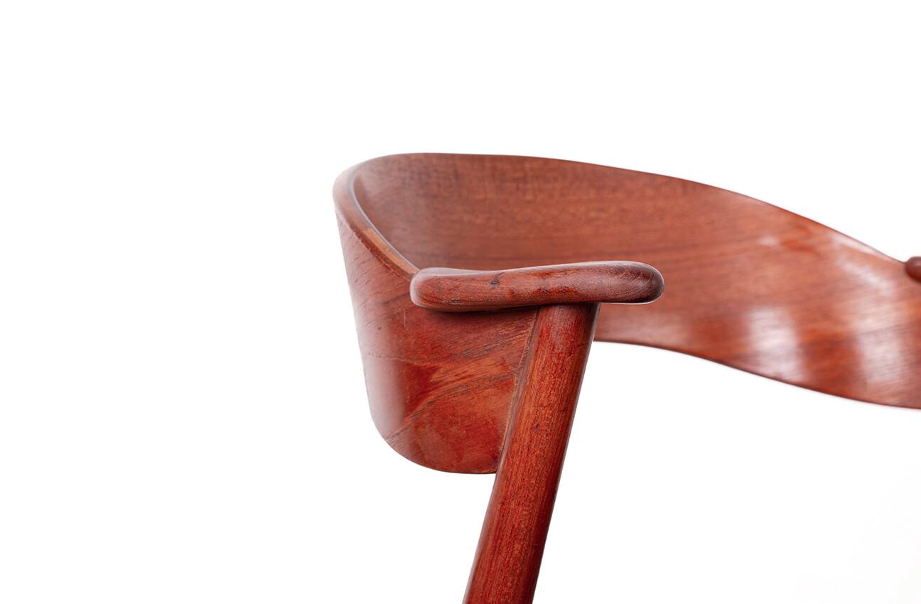 Danish armchair in teak and Skai, by Henning Kjaernulf for Korup Stolefabr.