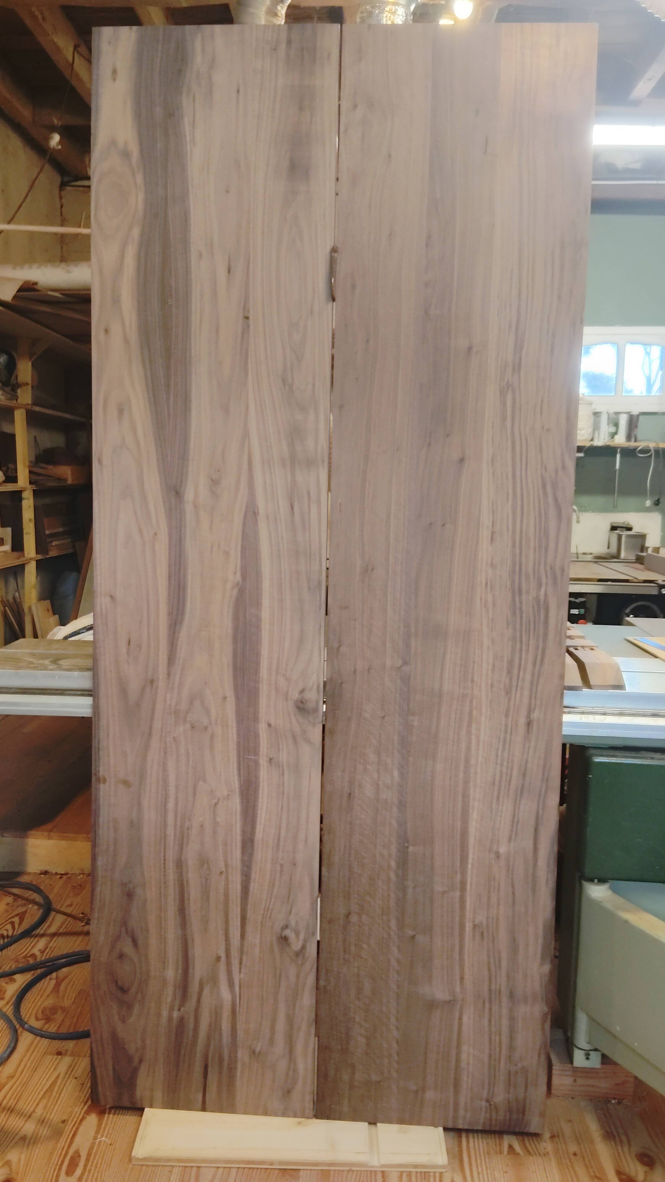 Exceptional dining table in solid walnut.