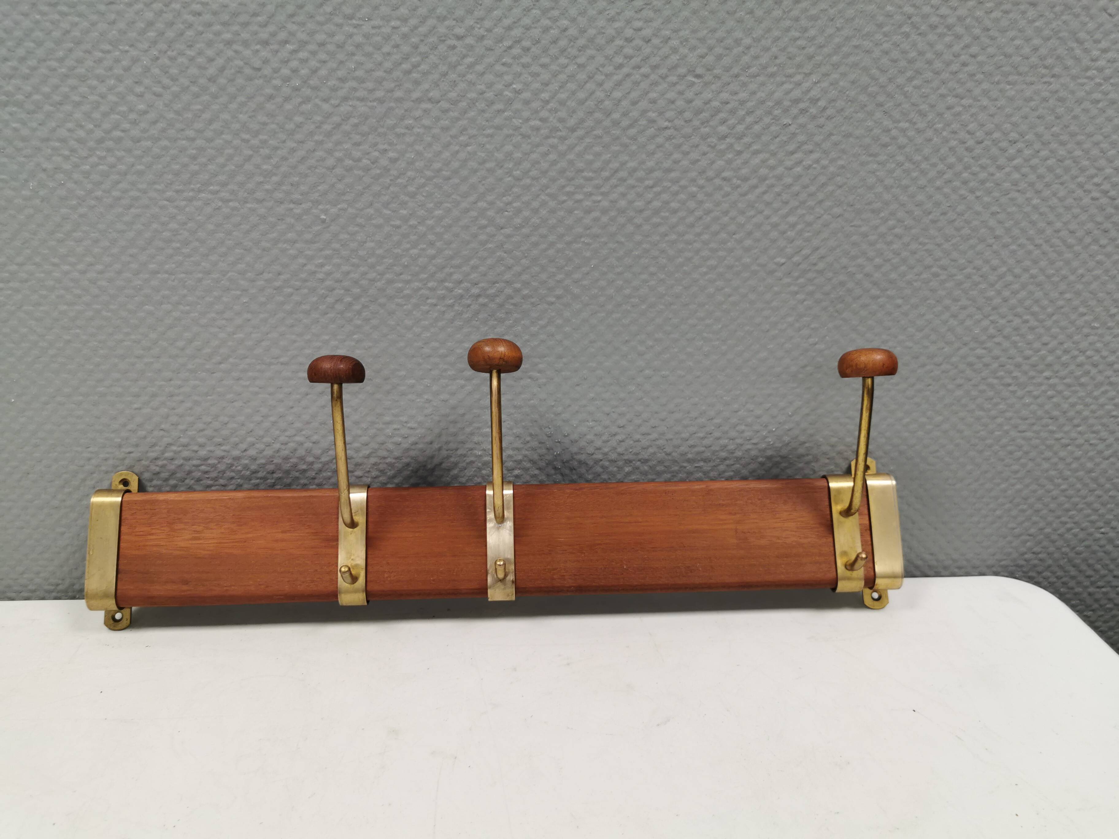 Danish teak and brass coat rack with adjustable hooks, 1960s.
