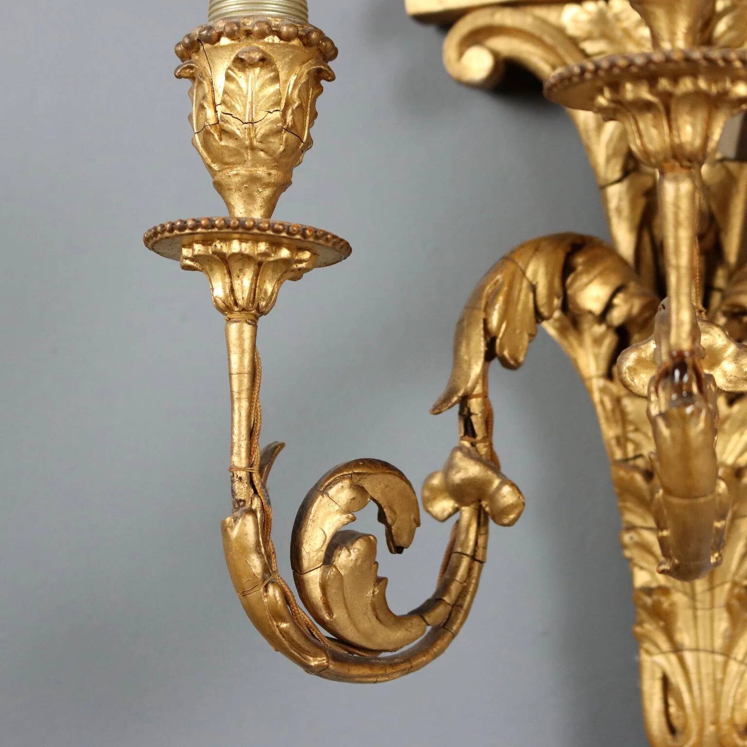 Antique neoclassical wall sconces in iron and wood, 19th century.