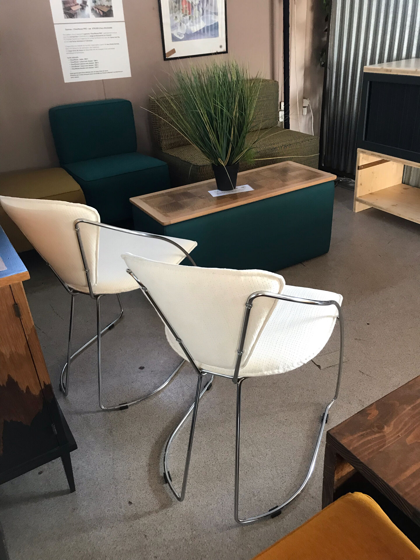 Set of two design chairs in steel and faux leather.