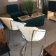 Set of two design chairs in steel and faux leather.