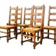 Set of 6 solid wood chairs with straw seats.