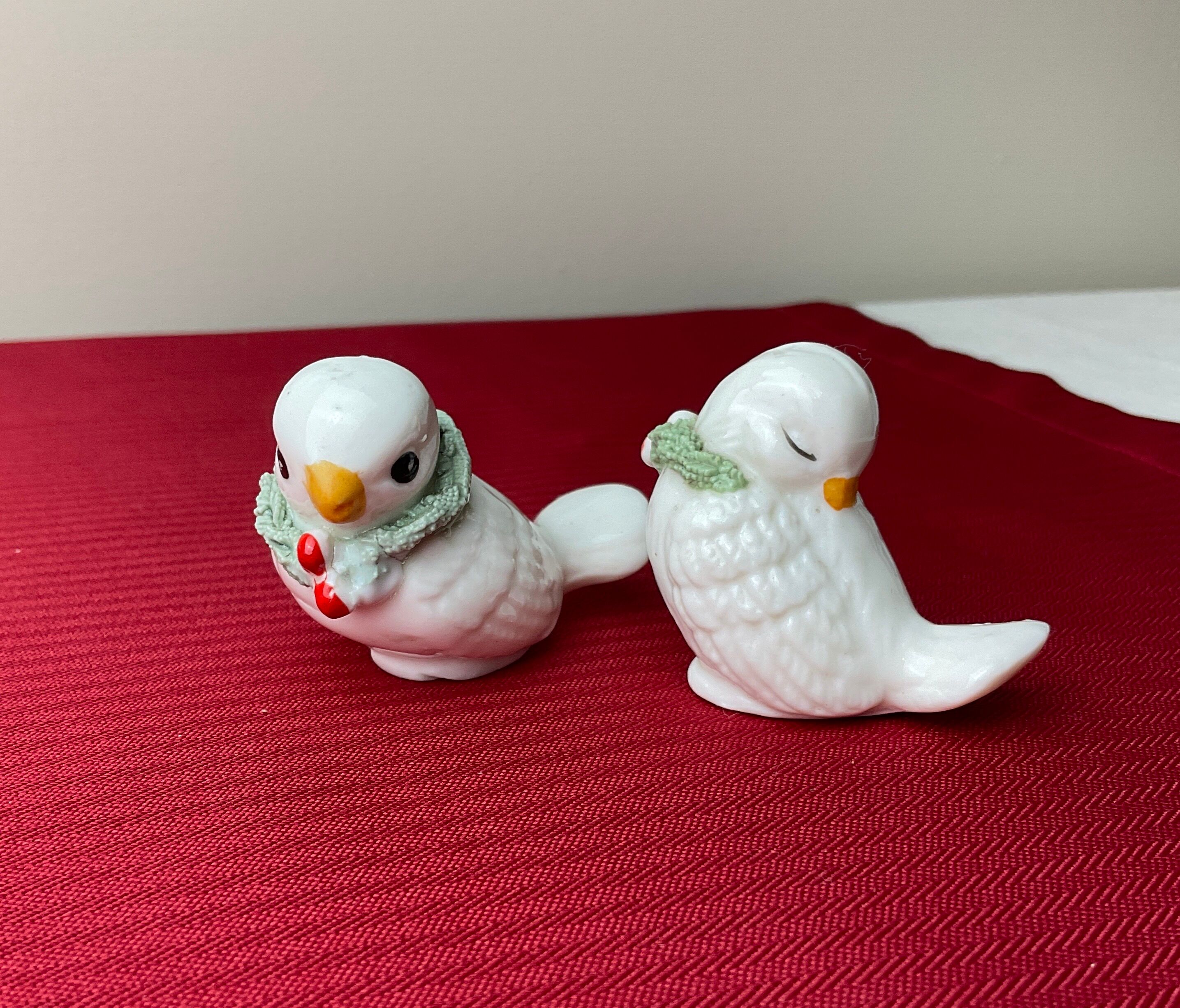 Pair of miniature white birds in ancient ceramics