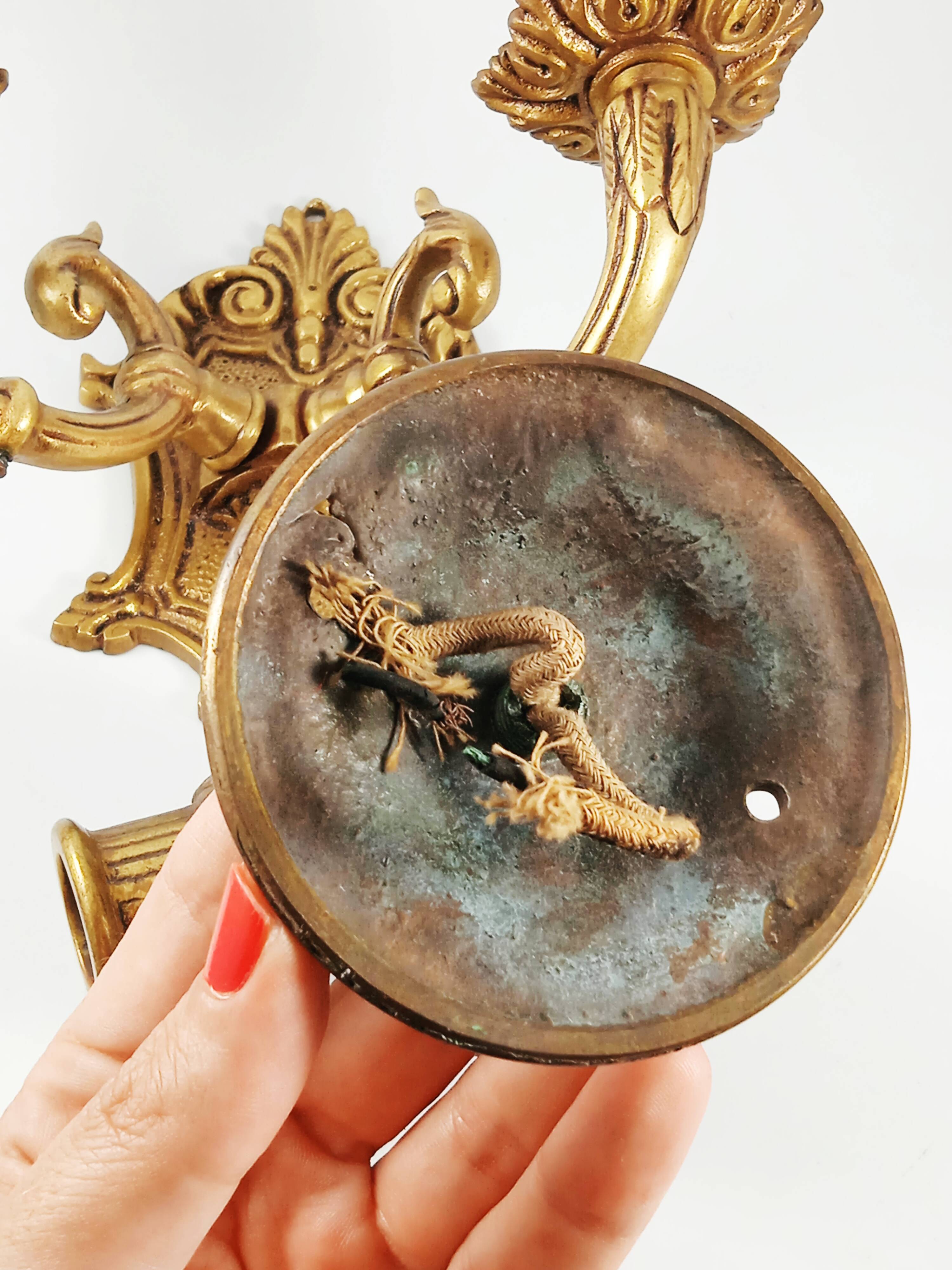 Set of 2 old candlestick sconces in bronze