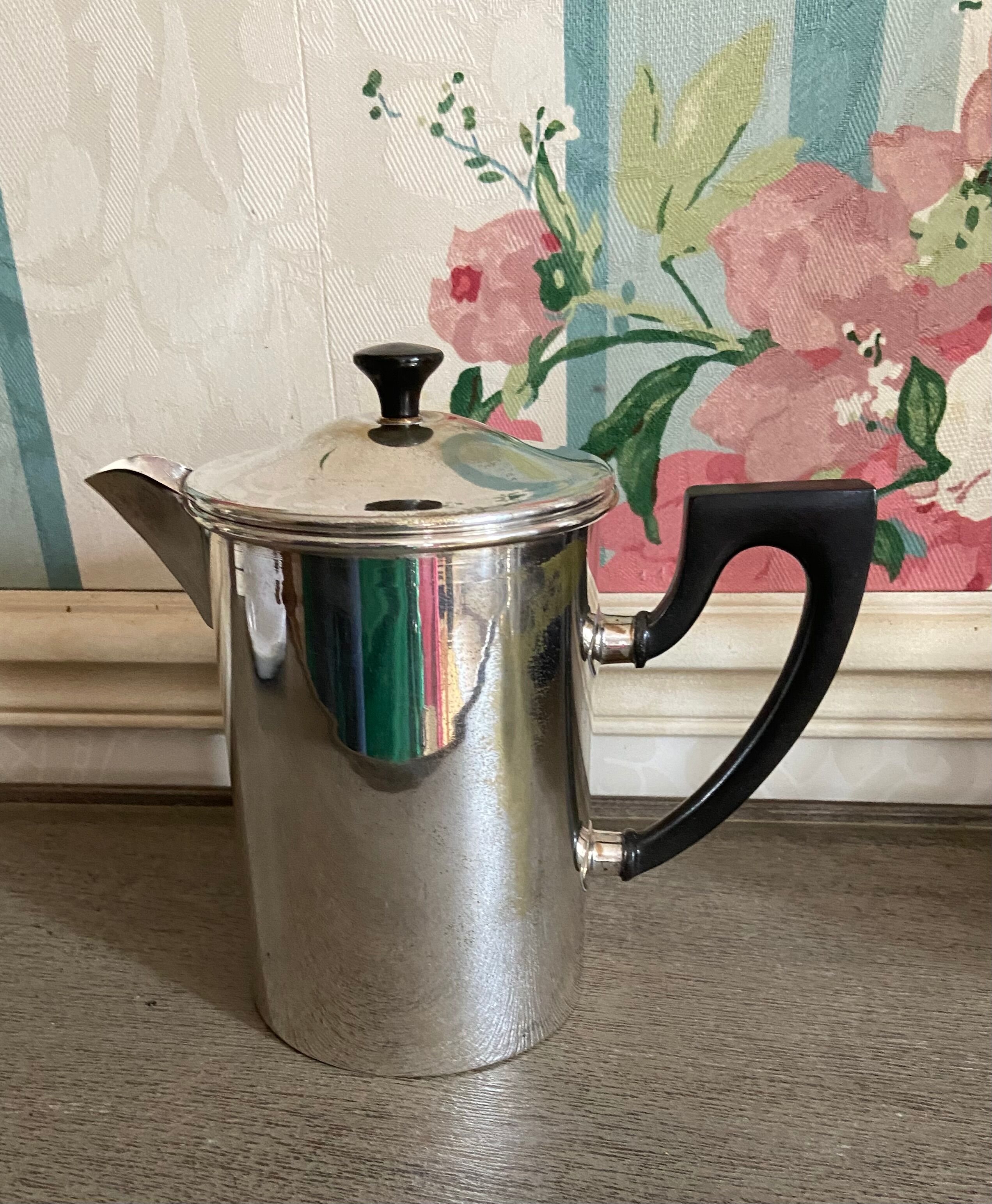 Old silver metal piston coffee maker
