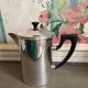 Old silver metal piston coffee maker