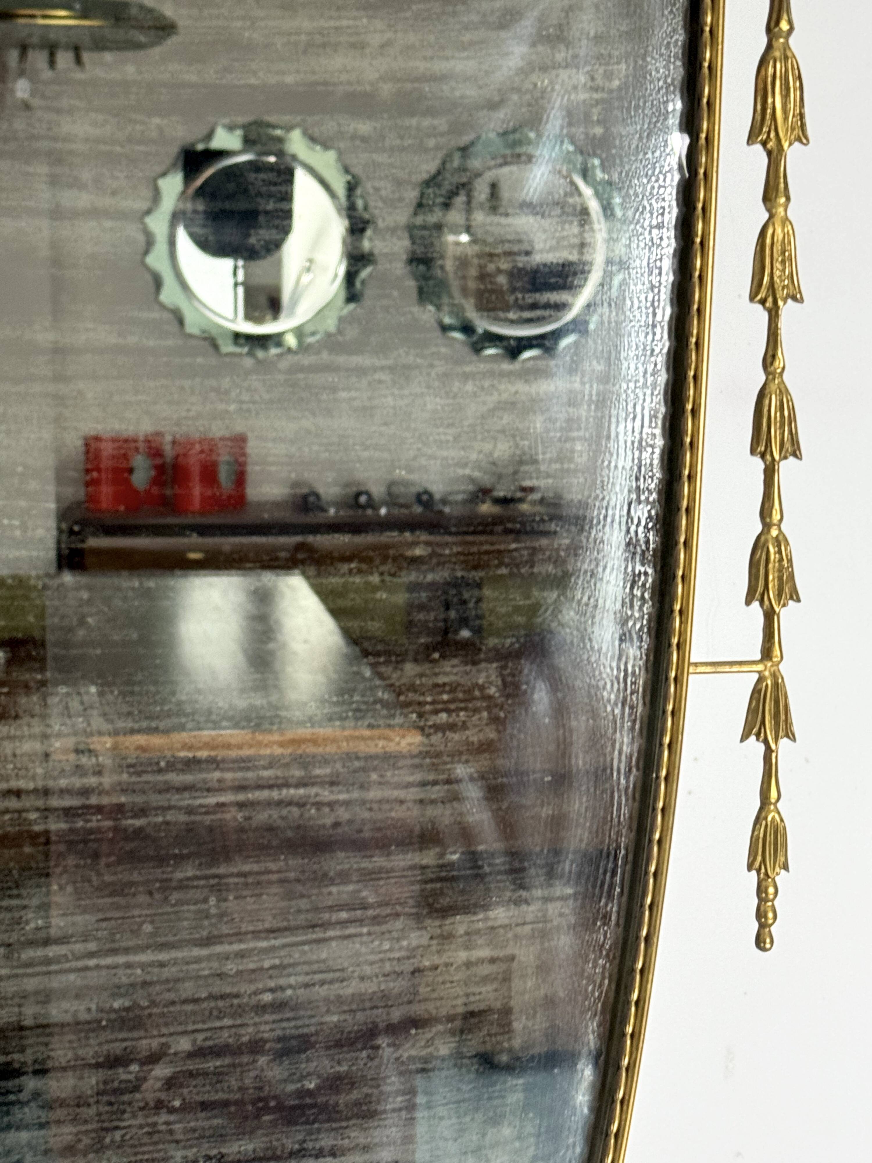 Mid-century Italian mirror in brass. Italy 1950s