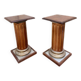Pair of antique-style columns in solid wood and gilding.