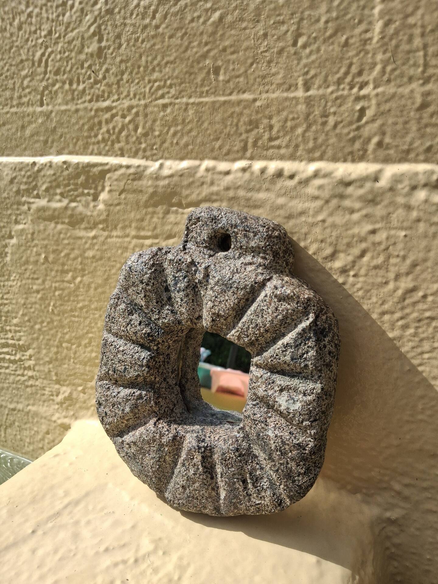Brutalist mirror in hand-carved natural stone