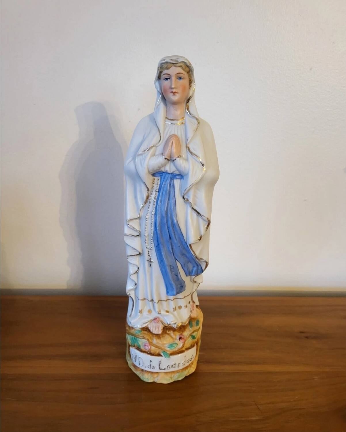 Religious statuette of the Virgin Mary in bisque porcelain