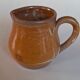 Creamy milk pot in sandstone