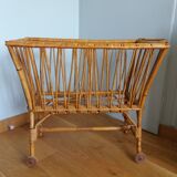 Rattan wicker cradle on wooden wheels