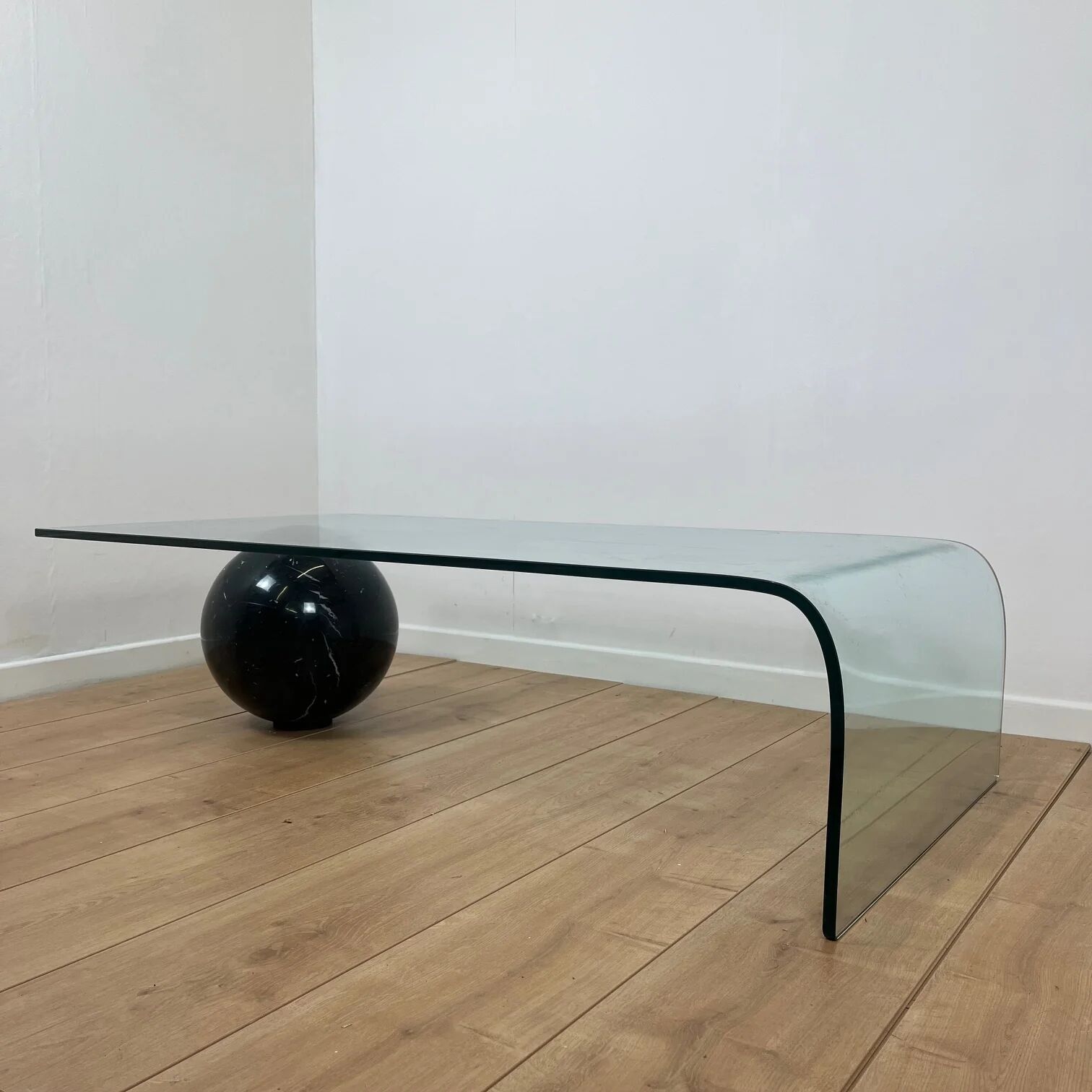 Coffee table in curved glass and black marble sphere, Giorgio Cattelan for Cattelan, 1980