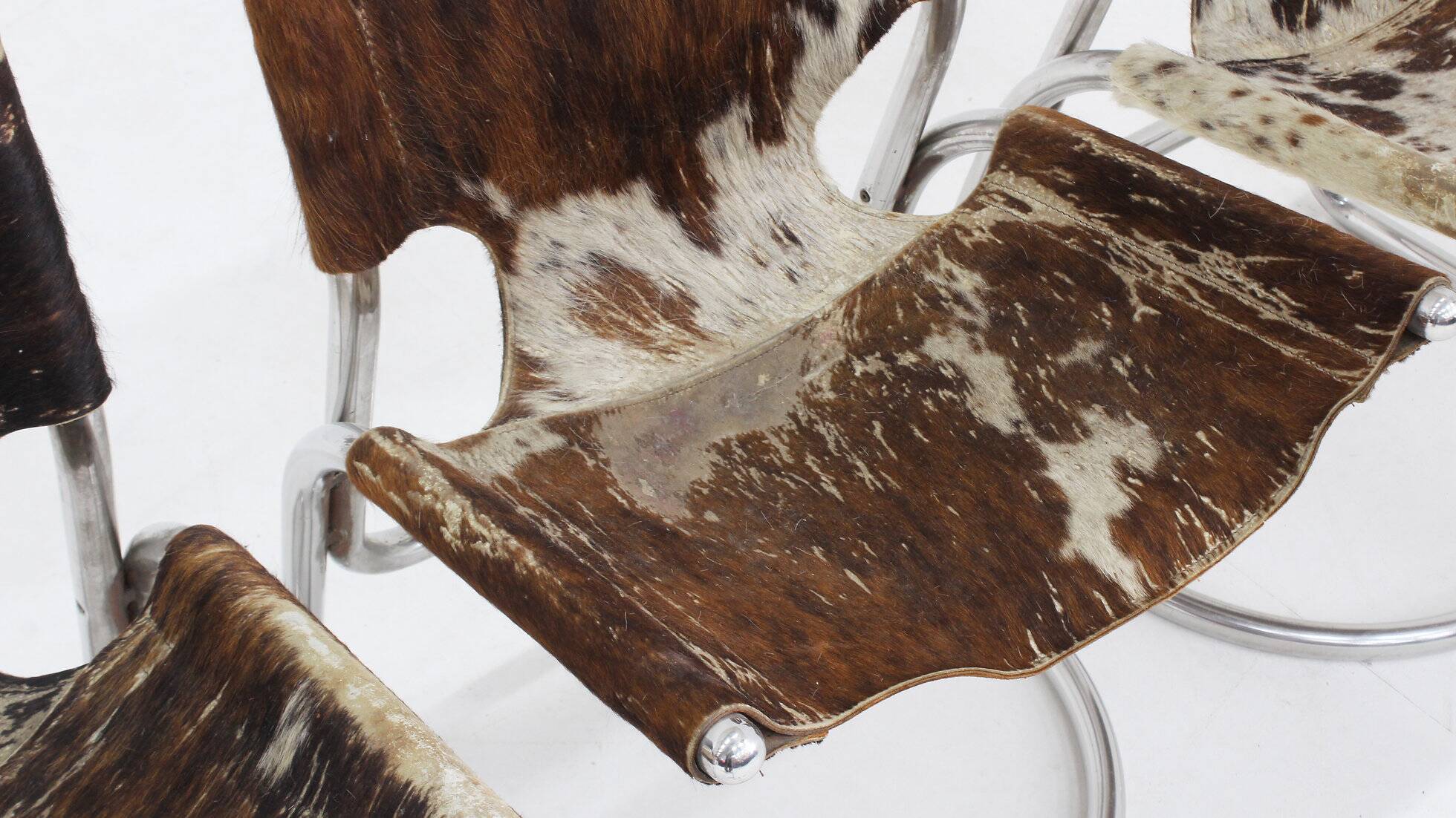 Vintage dining room chairs chrome and cowhide by Parravicini Fratelli