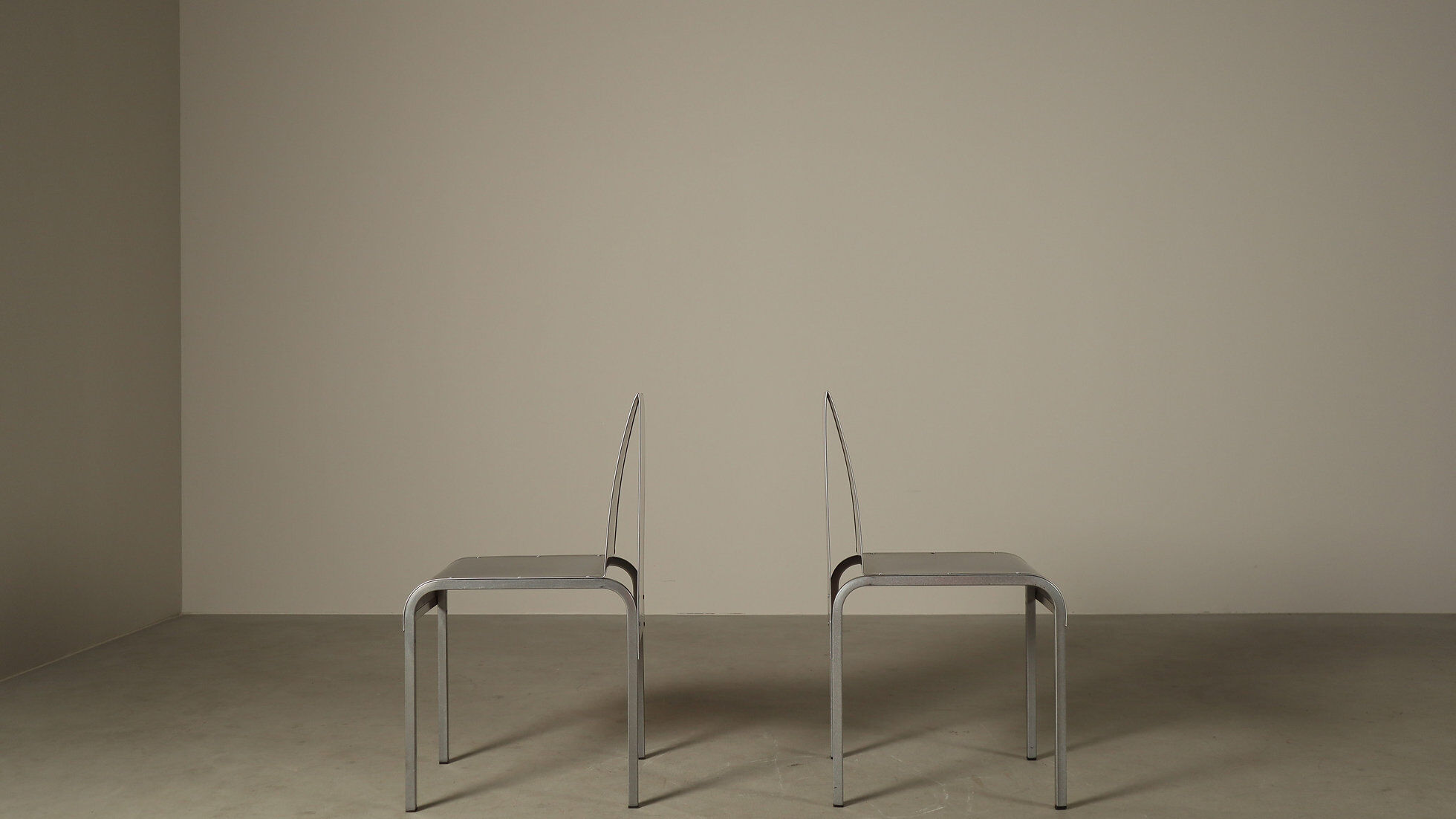 Set of six postmodernist stainless steel dining chairs from circa 1980-1990.