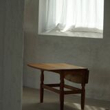 Modern Danish folding side table in solid oak, mid-20th century.