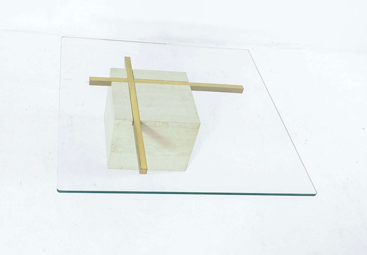 Coffee table with travertine gold-plated cross base and glass top