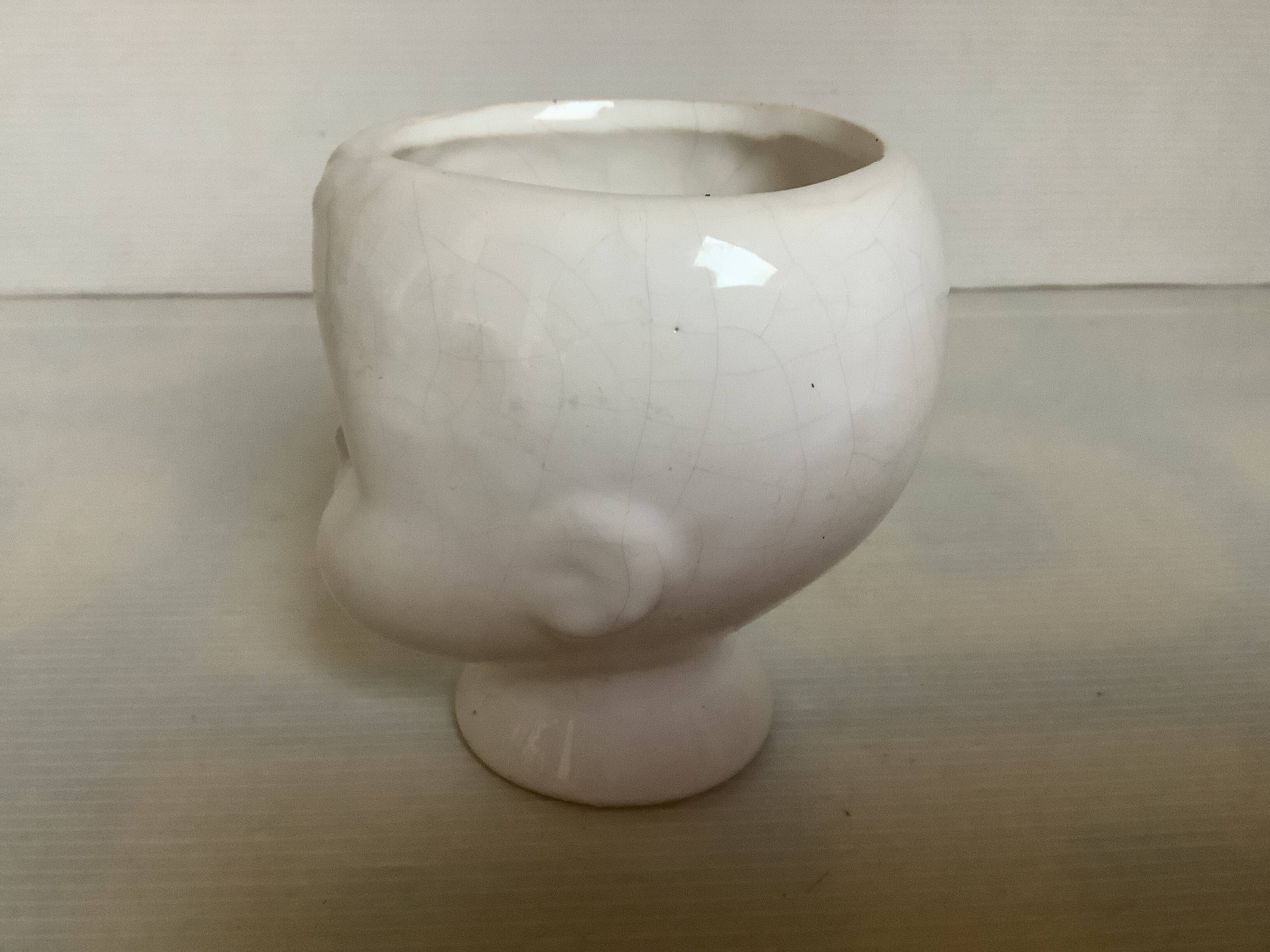 Baby doll shaped vase planter