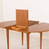Scandinavian round teak table with hidden extension, 1970s