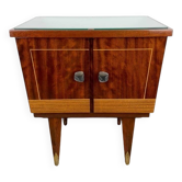 1950s bedside table in varnished wood veneer and brass.