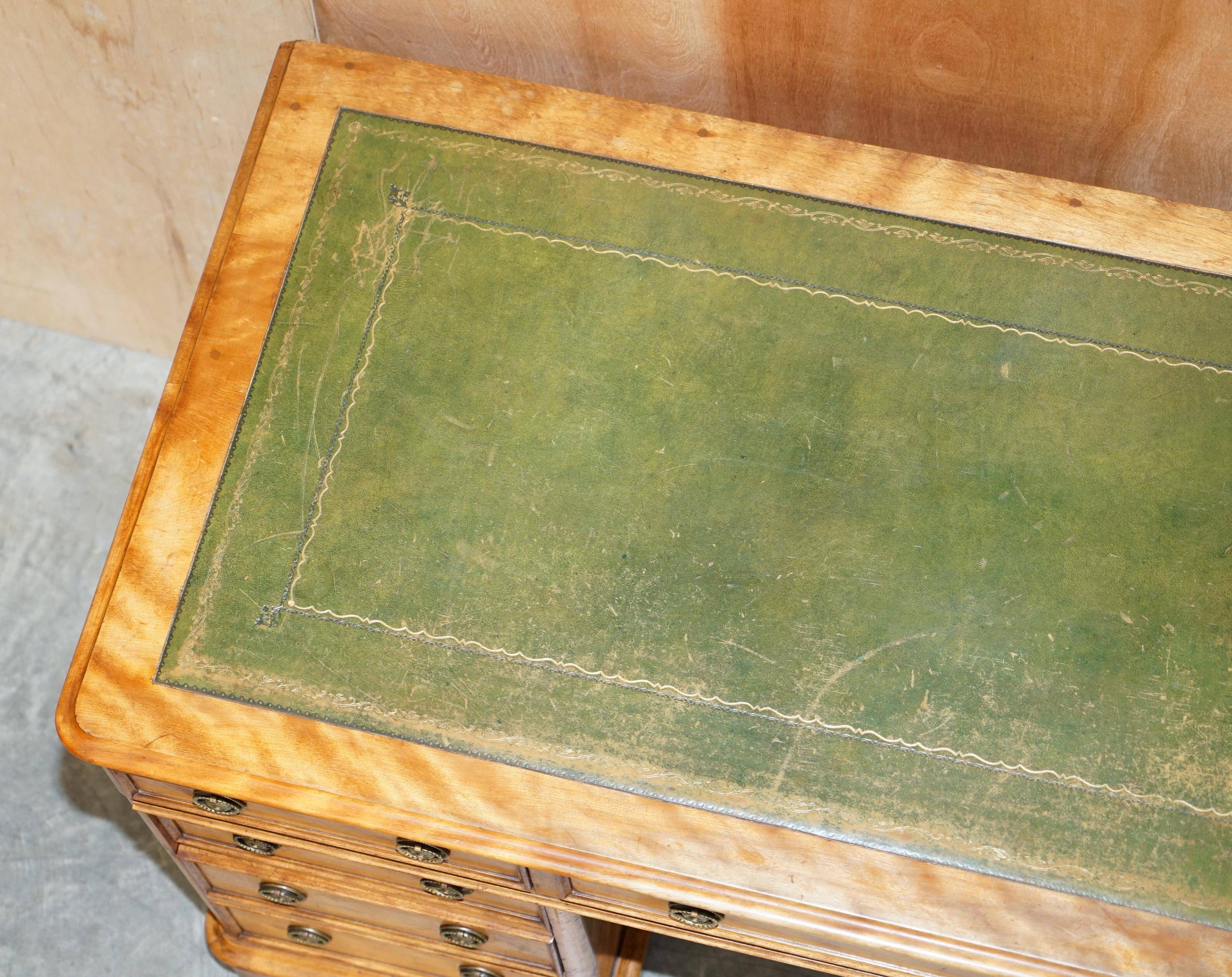 Antique desk by James Winter & Sons London in satin wood and leather.