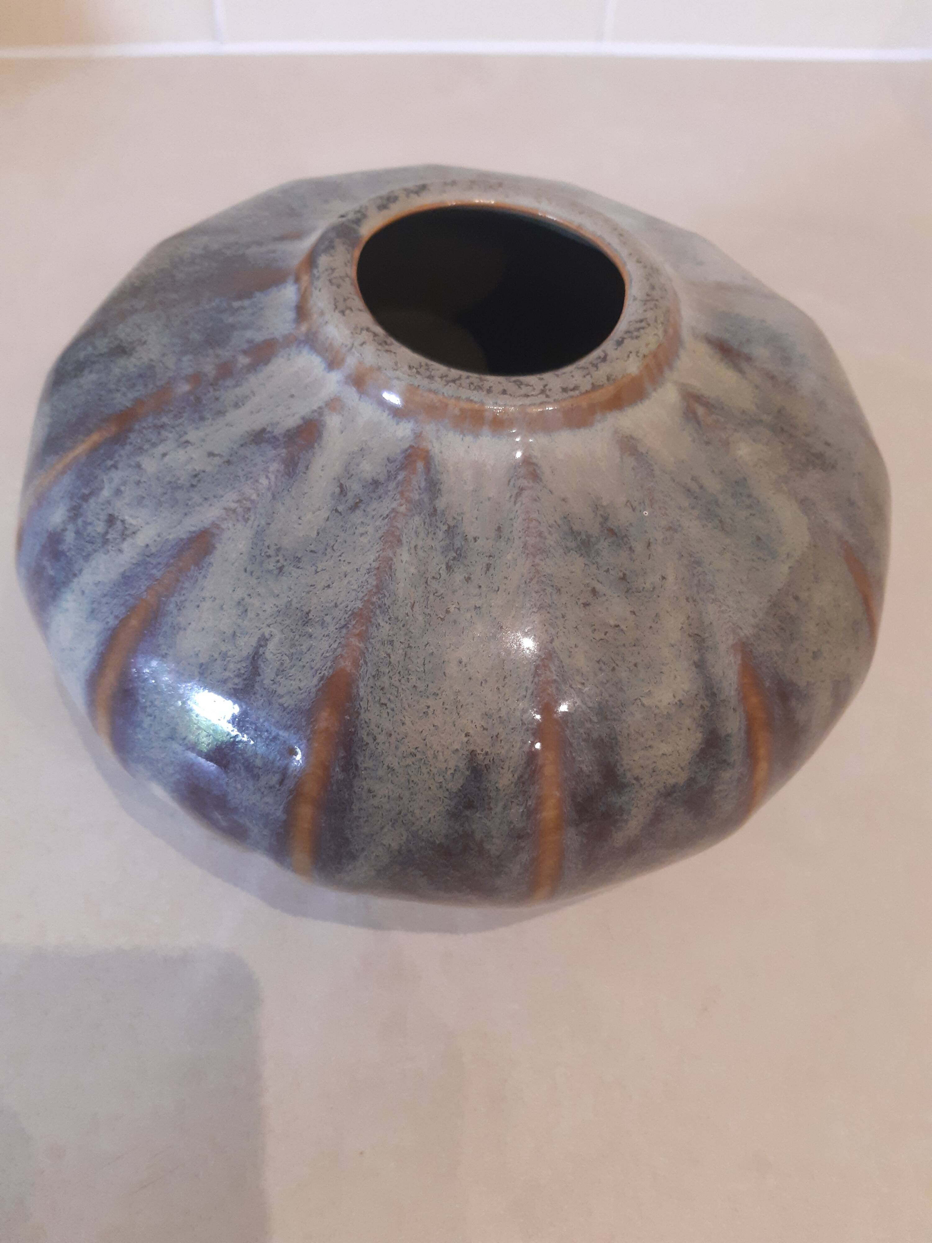 Globe vase, narrow neck, wide body.