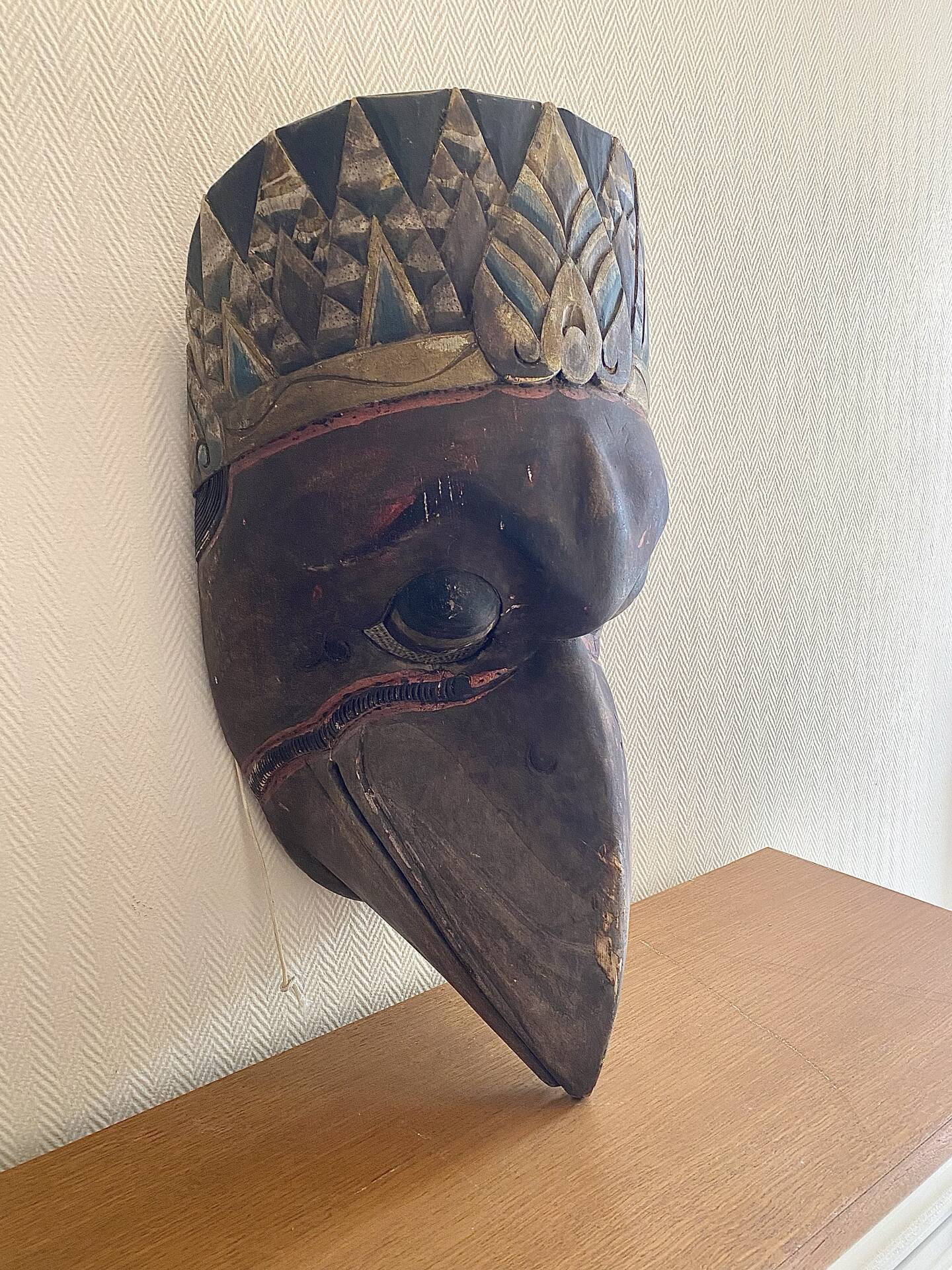 Grand traditional Indonesian mask carved from wood.