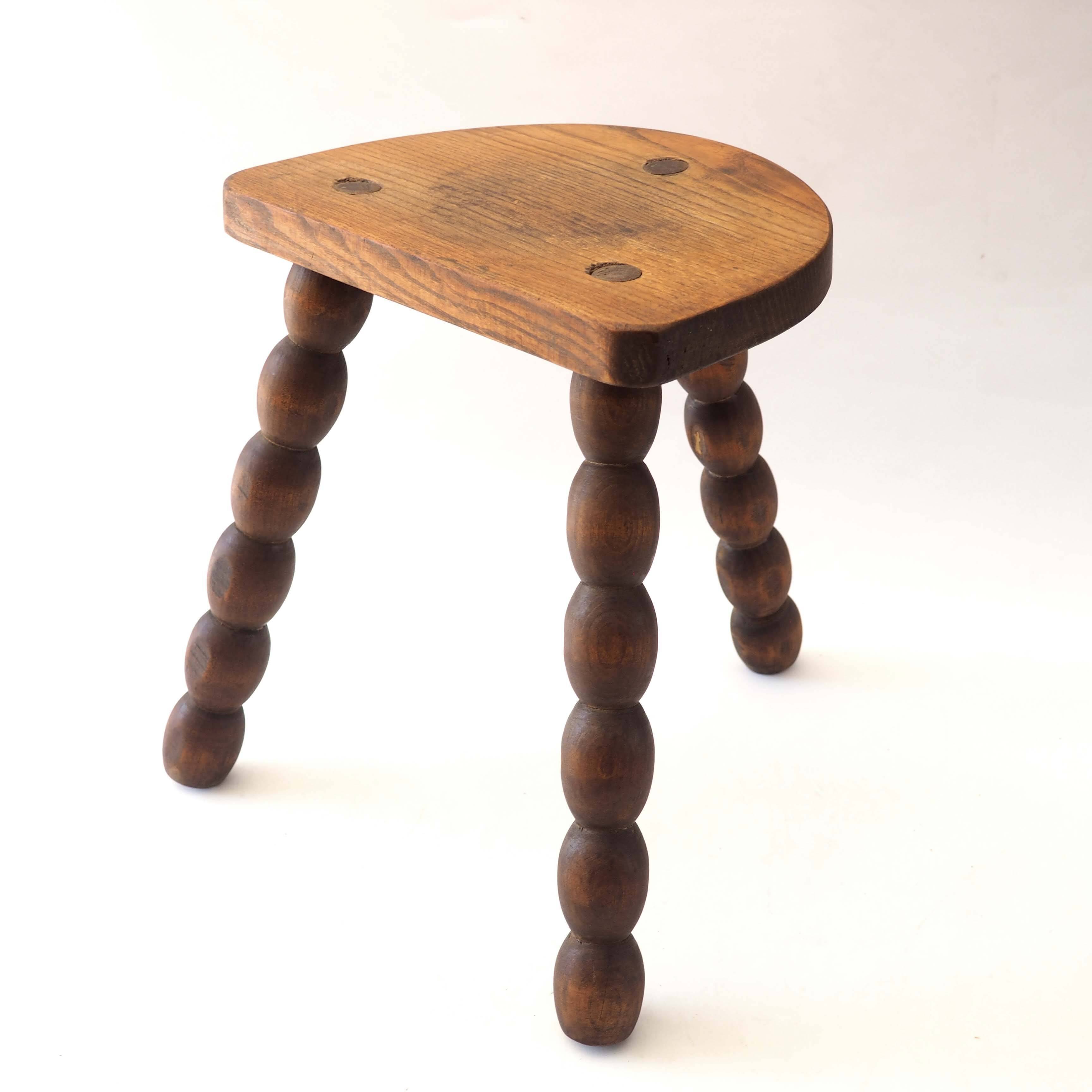 Beaded tripod stool