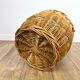 Old demijohn in her wicker basket
