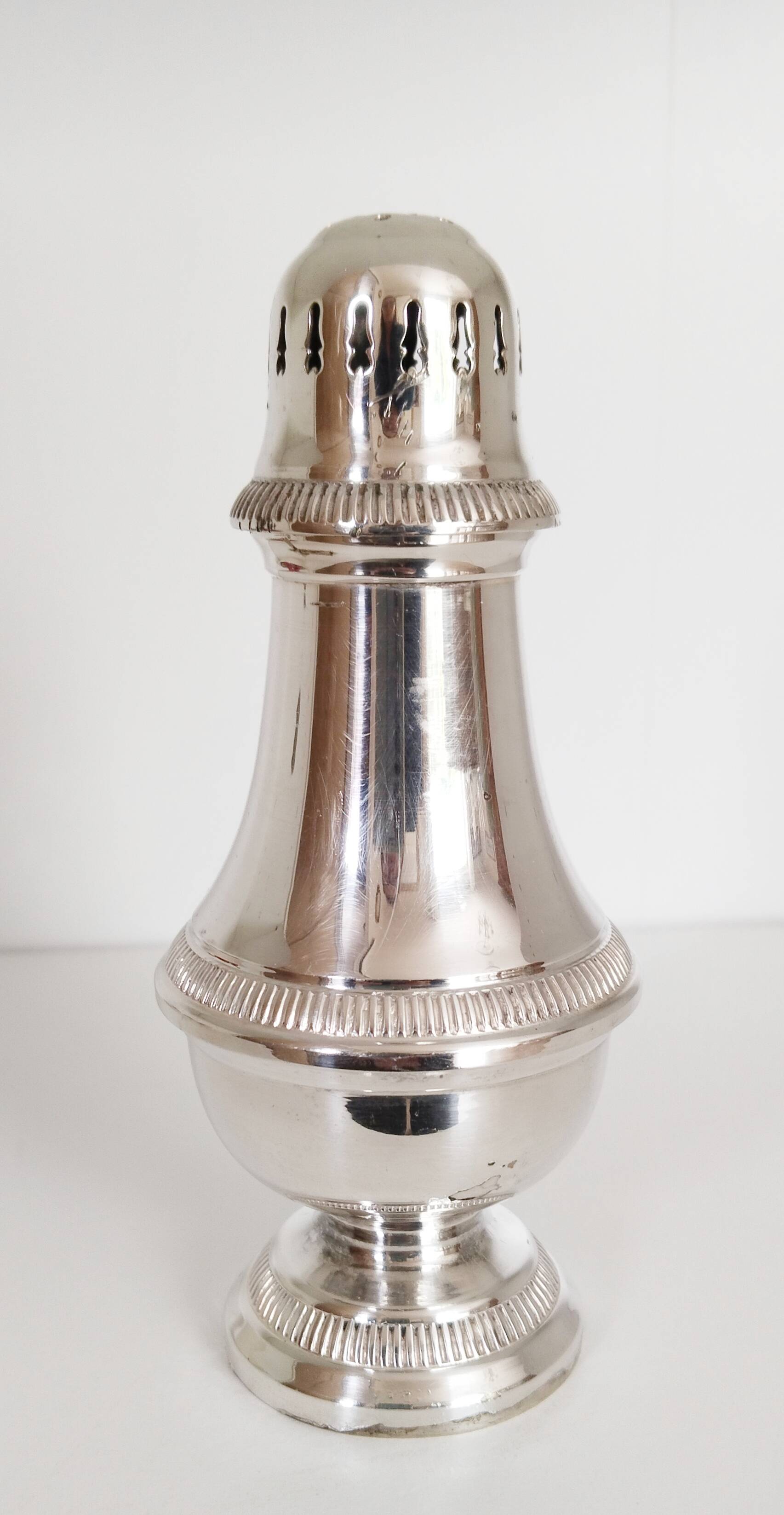 Silver-plated sugar shaker with fluted edges