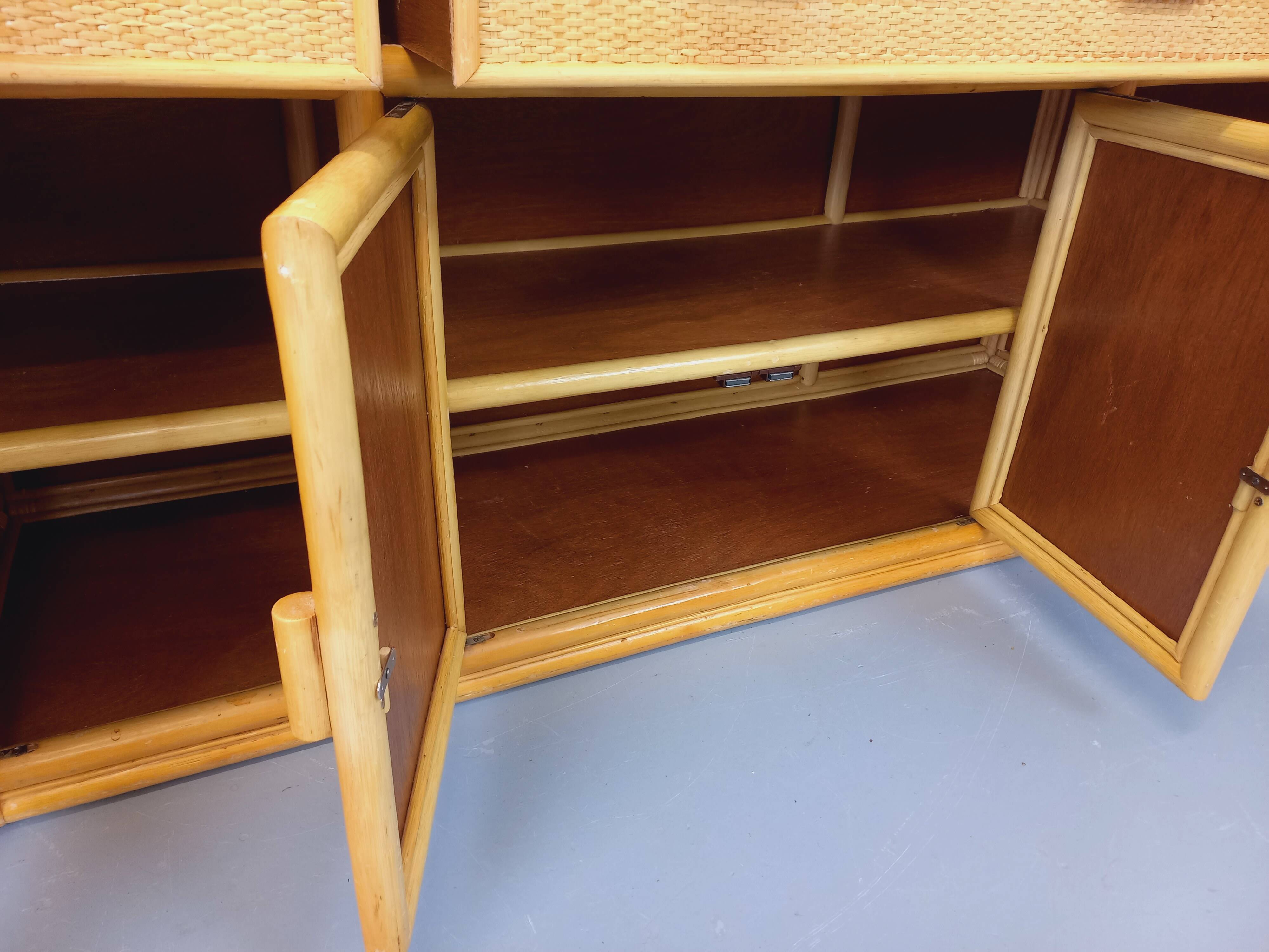 Vintage storage unit in rattan and woven rattan from the 1970s.