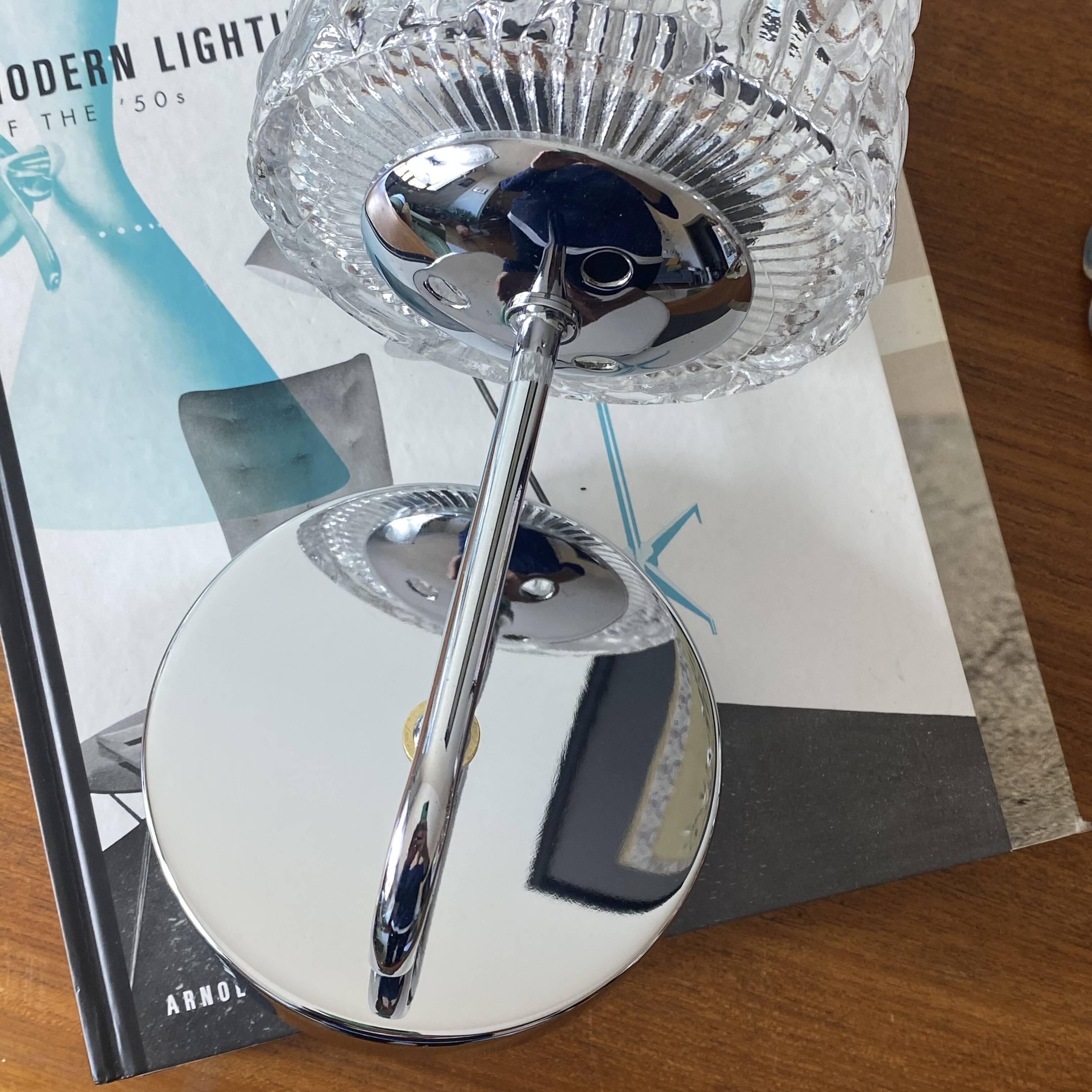 Swan neck wall light in stainless steel, thick glass shade, stainless steel rose.