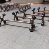 17 Christofle silver-plated knife rests in the Atonium model.