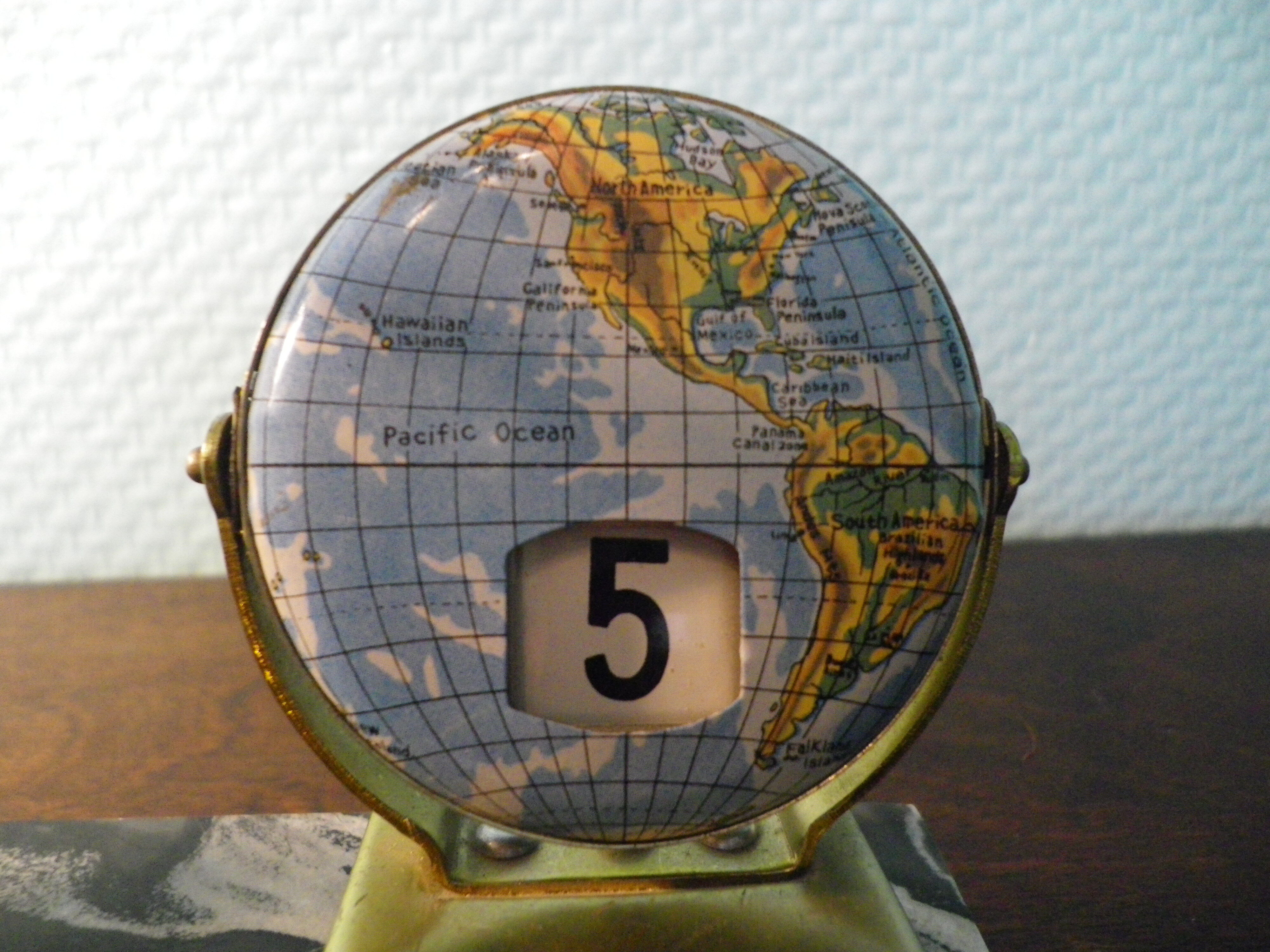 Perpetual calendar on marble base with marble patinated regulated decoration, 60s